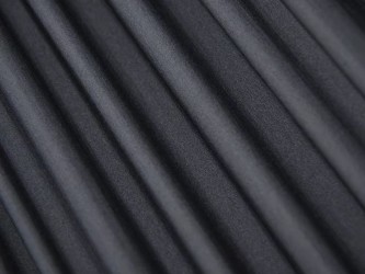 Gros plan sur la texture du tissu technique noir du hamac Adventure Ultra Light